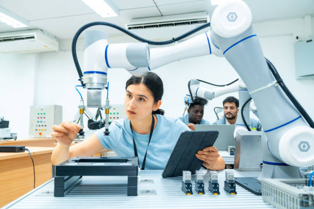istock Female engineer working with robotic machine in factory. 2147681904
