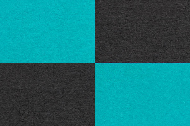 istock Texture craft turquoise and black paper background with cells pattern, macro. Vintage kraft cerulean cardboard. 2147682457