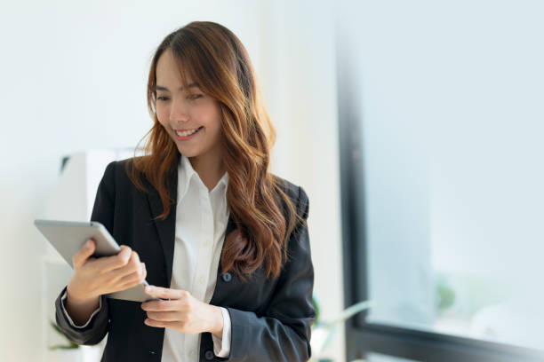 istock Happy business woman with digital tablet Inside the office. 2147682650