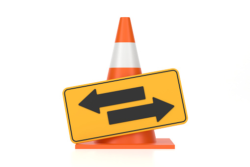 Traffic Cone And Two Way Arrow Sign On White Background