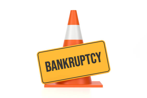istock Traffic Cone And Bankruptcy Sign 2147684157