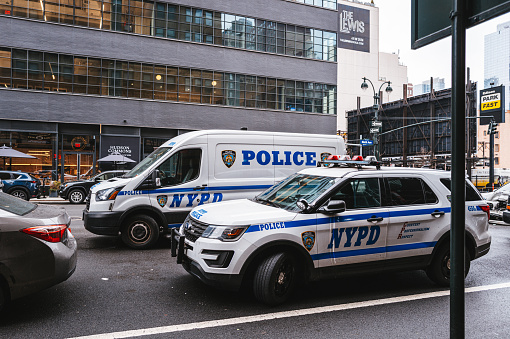 Coney Island, New York City, USA - June 18, 2022:    Antique police cars at Mermaid Parade, Surf Avenue, the largest art parade in the nation.