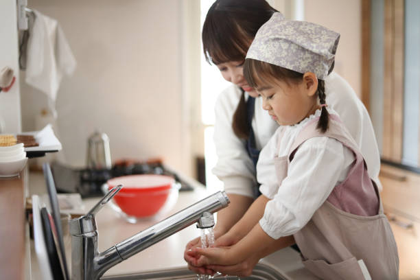 istock Parent and child washing hands 2147686269
