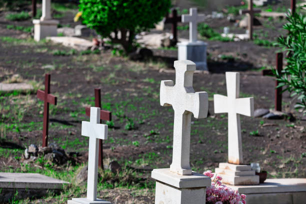old gravestones with crosses at a catholic church near Garmisch-Partenkirchen, Bavaria, Germany