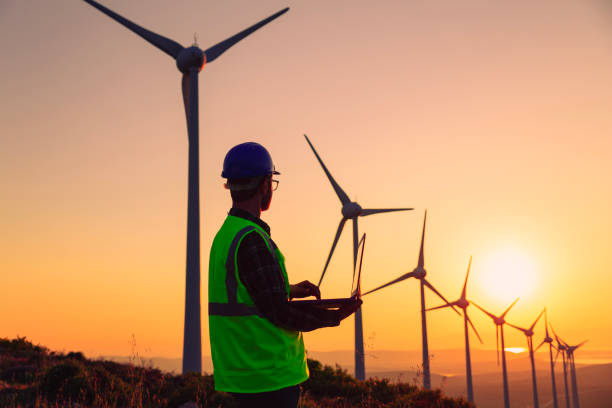 istock Renewable Energy Systems Innovator: Engineer Planning at Wind Turbines Farm 2147686905