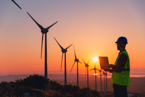 istock Renewable Energy Systems Innovator: Engineer Planning at Wind Turbines Farm 2147687145