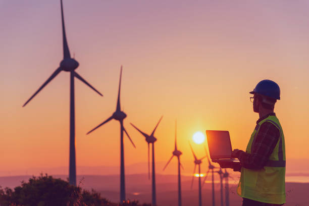 istock Renewable Energy Systems Innovator: Engineer Planning at Wind Turbines Farm 2147687180