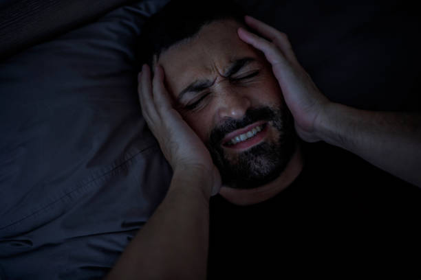 istock A sad millennial Arab man is worried, suffers from insomnia and headache. 2147688835