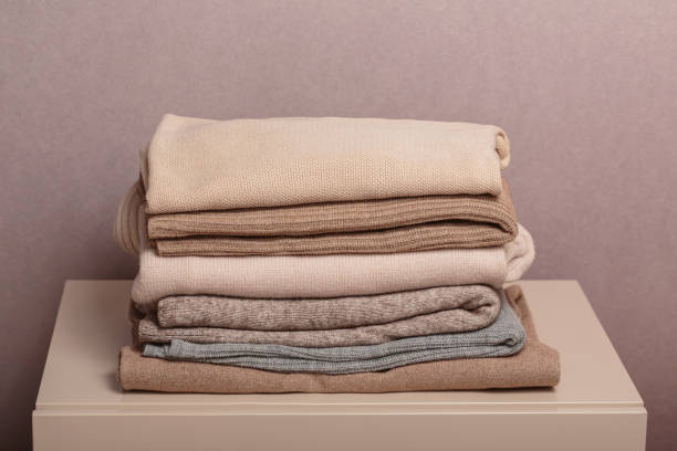 istock Stack of second hand clothes, ready to give away, used wardrobe 2147688986