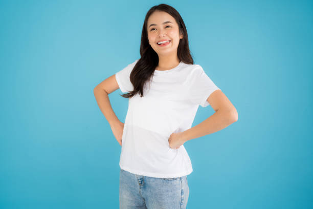istock Beautiful Asian woman standing doing various poses on a blue background. 2147689189