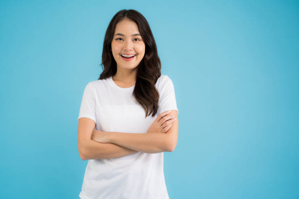 istock Beautiful Asian woman standing doing various poses on a blue background. 2147689314