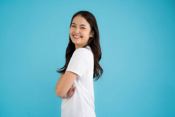 istock Beautiful Asian woman standing doing various poses on a blue background. 2147689317