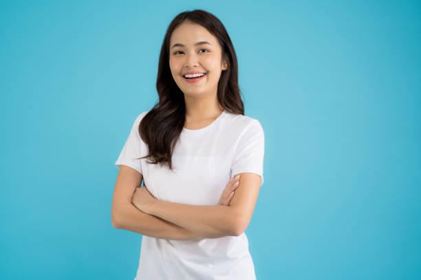 istock Beautiful Asian woman standing doing various poses on a blue background. 2147689320