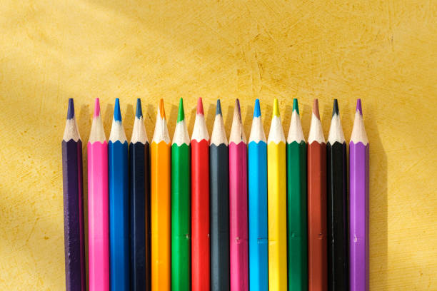 istock Coloured pencils for drawing on a yellow background 2147689684