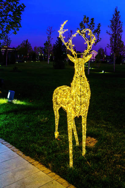 istock A luminous christmas deer from garlands. 2147689895
