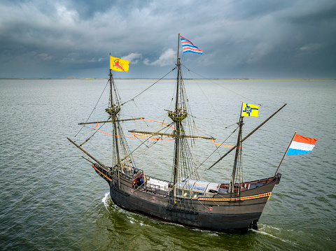 Old VOC sailing ship Halve Maen replica sailing at the Ketelmeer in Flevoland, The Netherlands. The Halve Maen was a trading ship of the Dutch East India Company (Dutch: Verenigde Oost-Indische Compagnie and sailed up the Hudson into what is now New York Harbor in 1609.