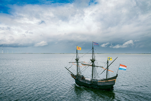 Old VOC sailing ship Halve Maen replica sailing at the Ketelmeer in Flevoland, The Netherlands. The Halve Maen was a trading ship of the Dutch East India Company (Dutch: Verenigde Oost-Indische Compagnie and sailed up the Hudson into what is now New York Harbor in 1609.