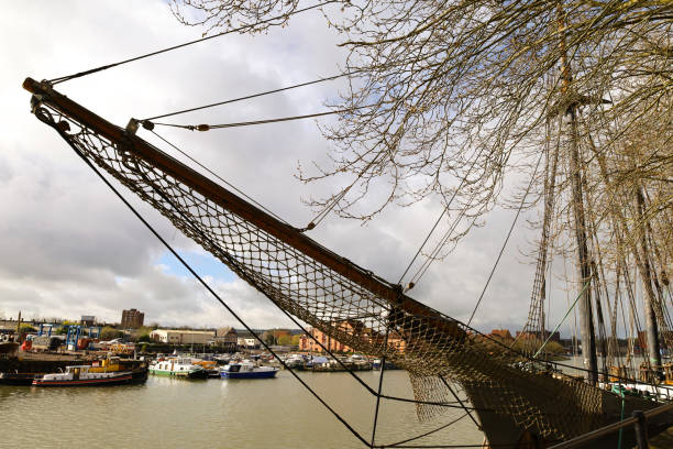 Bristol, England- March 29, 2024: Old wooden ship moored at The dock in Harbourside area in Bristol