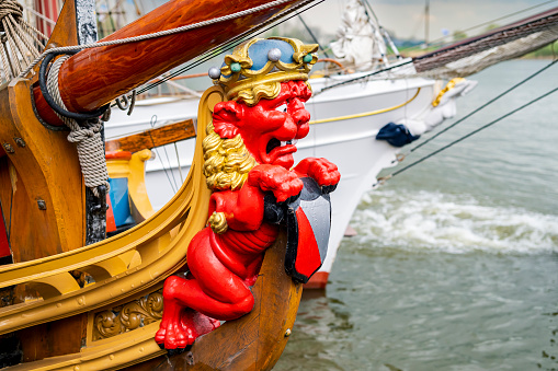 Wooden lion figurehead on the state yacht Utrecht moored at the qauy in Kampen at the river IJssel during the 2024 Sail Kampen event.