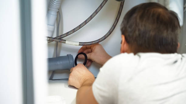 istock Plumbing replacement gasket. Plumber repairs plumbing pipes sewerage 2147693815