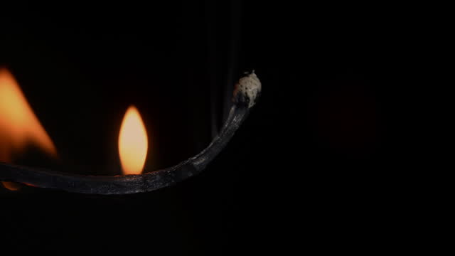 ignition and burning of a match macro shot