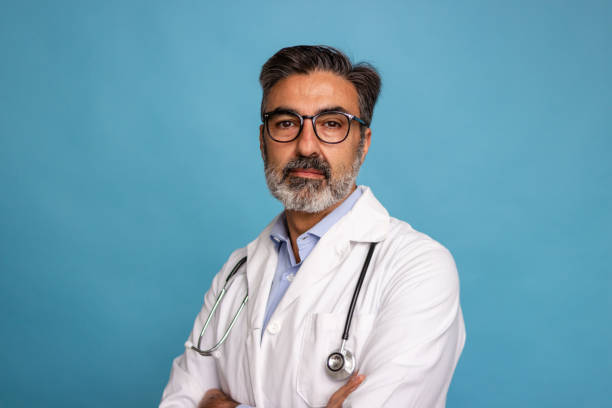 istock Confident mature male doctor with stethoscope 2147696907