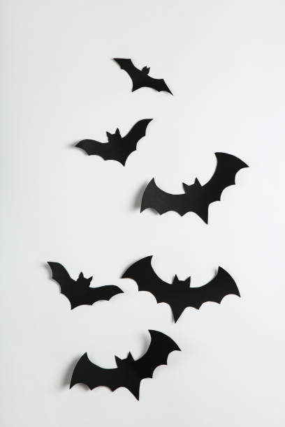 istock Halloween paper bats on grey background 2147698938