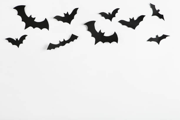 istock Halloween paper bats on grey background 2147698955