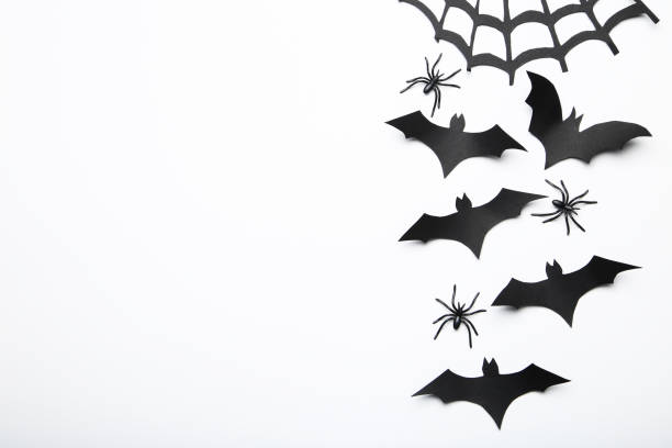 istock Halloween paper bats with spiderweb and spiders on white background 2147699022