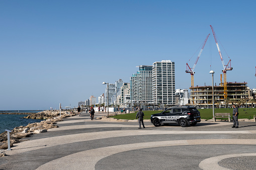 Tel Aviv, Israel - April 4, 2024: Israeli police patrol the beachside promenade in Tel Aviv.