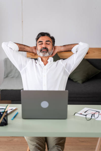 istock Relaxed businessman taking a break at desk 2147700602