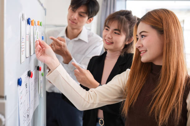 istock Creative team of designers in application design and ux/ui usability planning. Modern business team teamwork. 2147701712