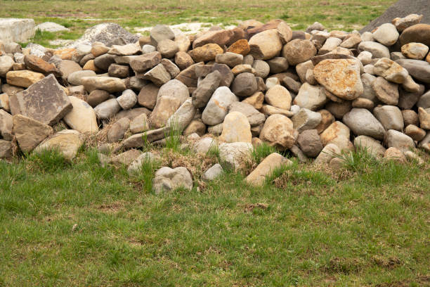 istock Natural yellow and grey smooth stones in construction site 2147704894