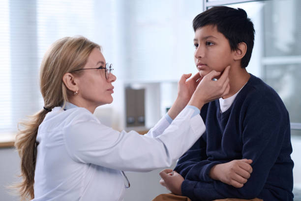 istock Female Pediatrician Examining Child 2147705559