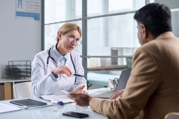 istock Female Doctor Wearing Glasses and Talking 2147705634