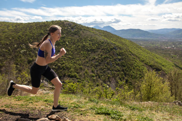 istock Young woman running on a mountain 2147706303