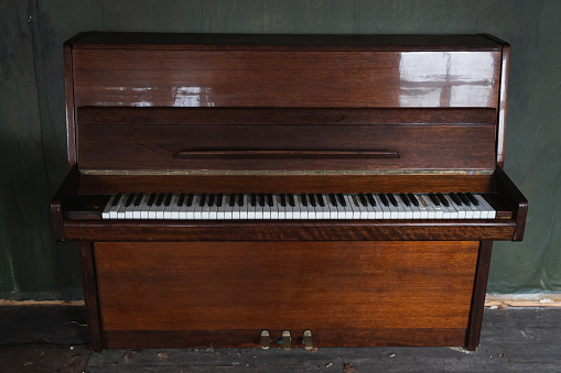 Old piano in an abandoned house. Close up photo