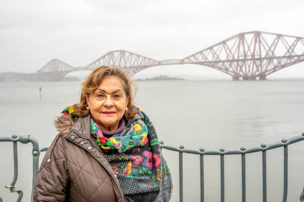 istock Senior Hispanic woman portrait at Forth Bridge Scotland 2147706971