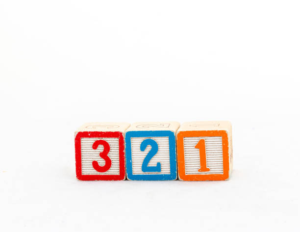 istock Wooden blocks with three, two and one number isolated on white background 2147707558