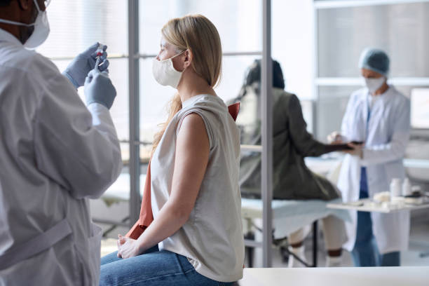 istock Woman with Open Shoulder Ready For Vaccination 2147707712