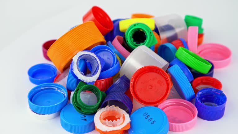 Multicolored Plastic Bottle Caps Isolated On White Background