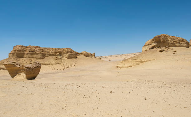 istock Barren desert landscape in hot climate with mountain rock formation 2147708355