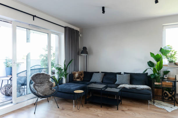 istock Comfortable sofa bed in living room with window  at home interior. 2147709578