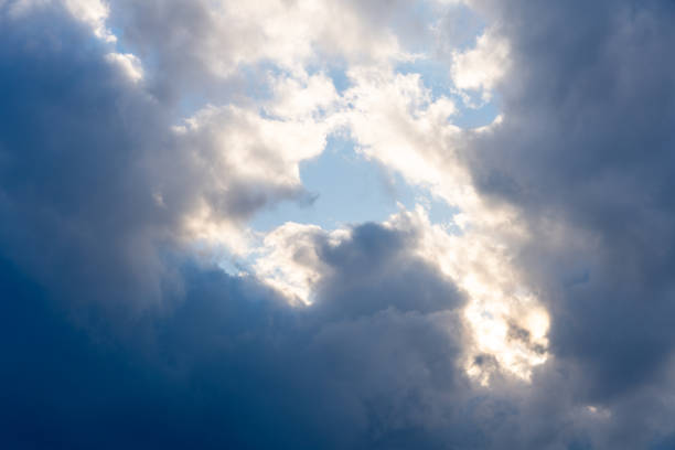 After the rain. Majestic clouds in the dramatic sky at sunset
