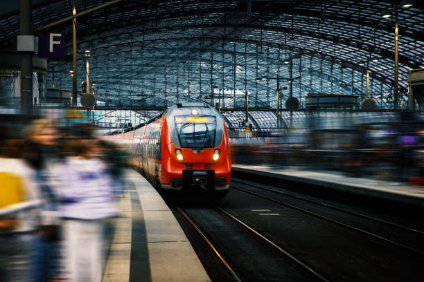 Arrival of a modern train at a large railway station