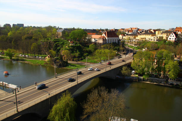 Halle, Germany - April 6, 2024: Giebichensteinbruecke, a bridge across Saale river with sculptures of cow and horse symbolising historical rural and urban districts of the city.