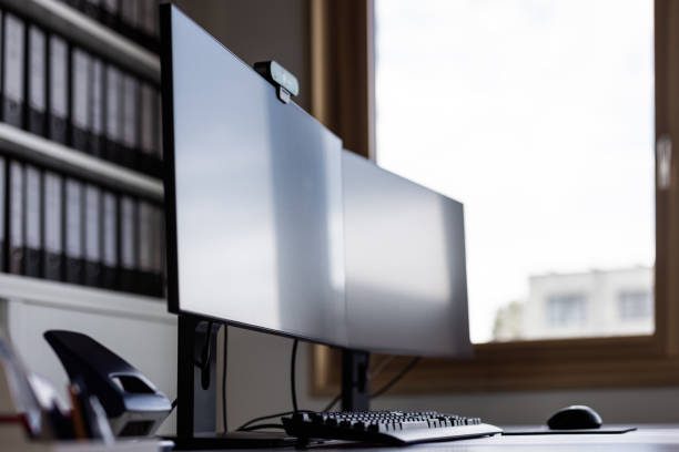 istock Close-Up Of A Desk With Tow Computer Displays In A Office 2147714521