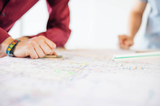 istock Close-Up Plan On A Office Desk With Two Businessman Writing Something 2147714525