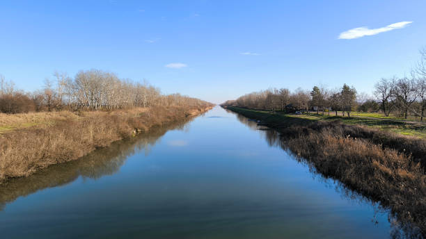 istock landscape by the river in sunny autumn day 2147714559