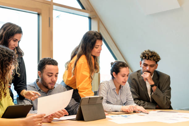 istock young diverse business team in meeting in office 2147715037